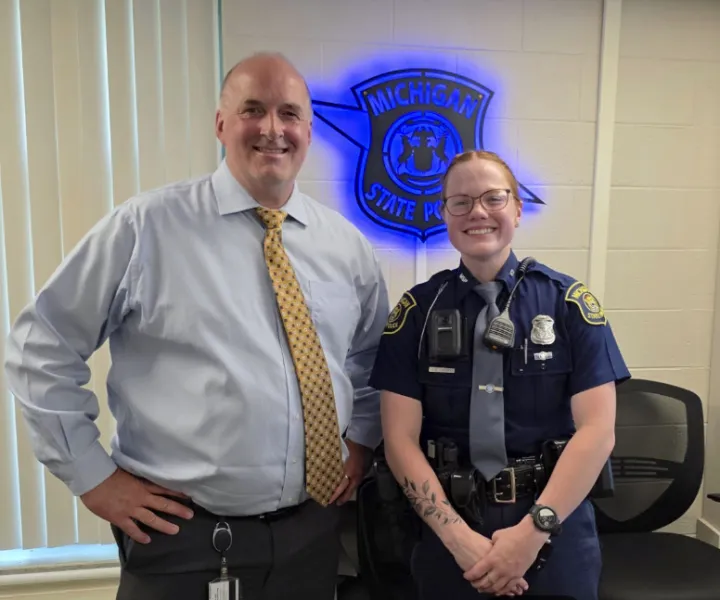 NMU instructor Christopher MacMaster with NMU grad and current MSP Trooper Jenna Leway