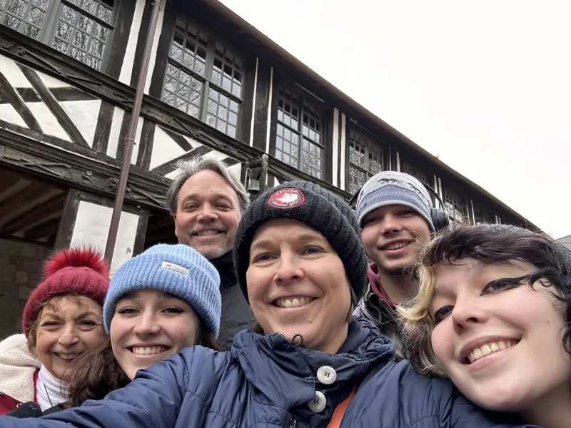 Olsen in back with his son, Ross. In front are (from left) his mother-in-law, Janet; daughter Charlotte; wife Jennifer; and daughter Emma.