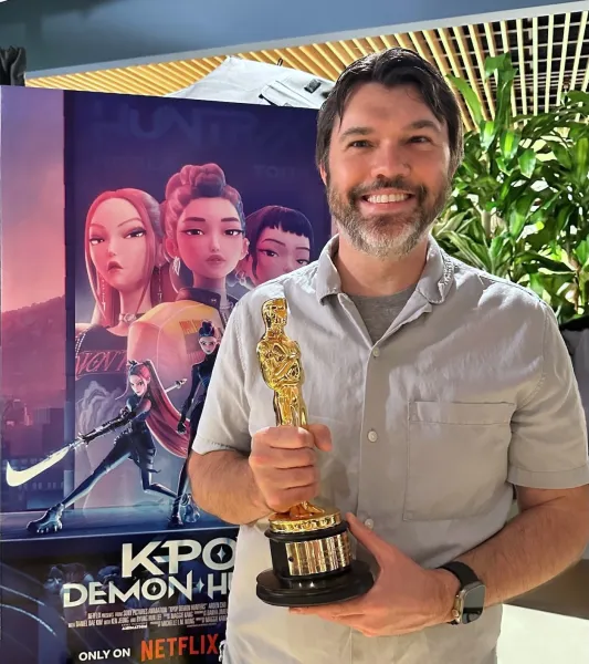 Thorburn holding an Oscar at Sony Pictures Animation's celebration
