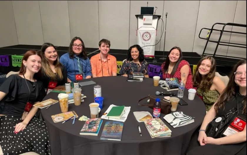 NMU students pictured with keynote speaker Aimee Nezhukumatathil (center)