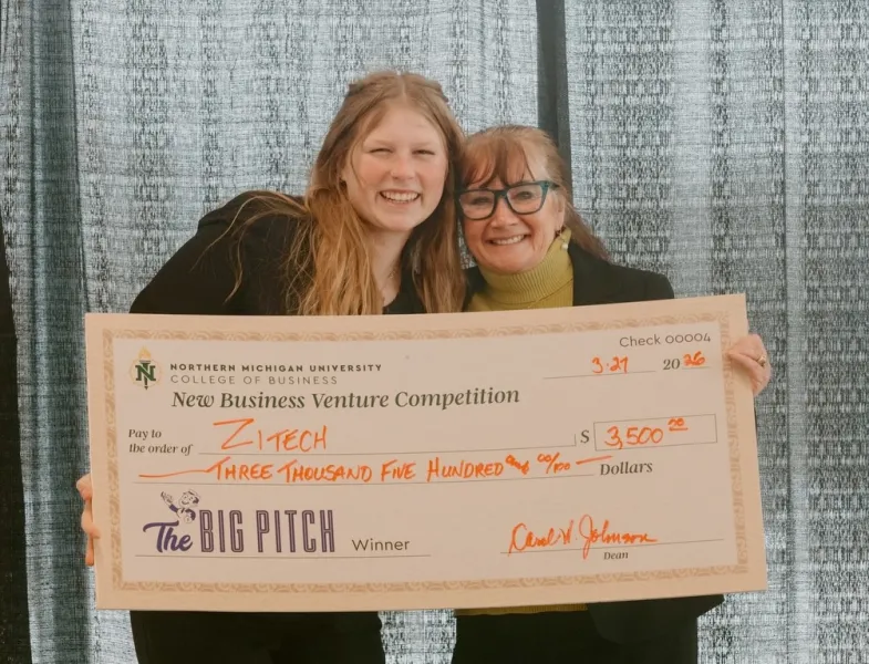 ZiTech founder Maya Van Berkum (left) with the $3,500 Big Pitch grand prize ceremonial check presented by College of Business Dean Carol Johnson.