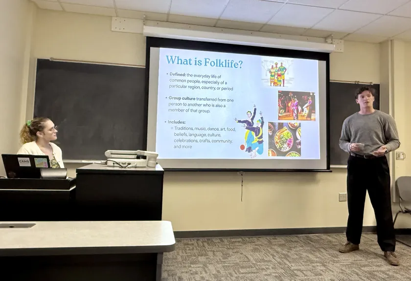 Student Truman Maher presents his group's findings to Ewalt, Truckey and the class.