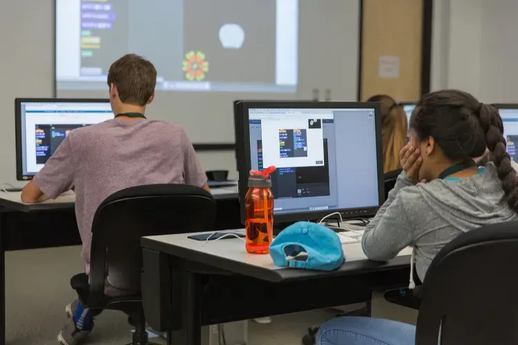 NMU stock photo of youth in a computer lab on campus