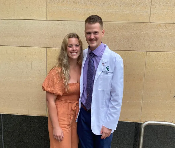 Dylan Bilicki with his wife, Angela, who also graduated from NMU.