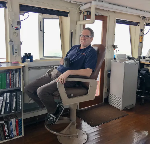 Hughes relaxing in the captain's seat