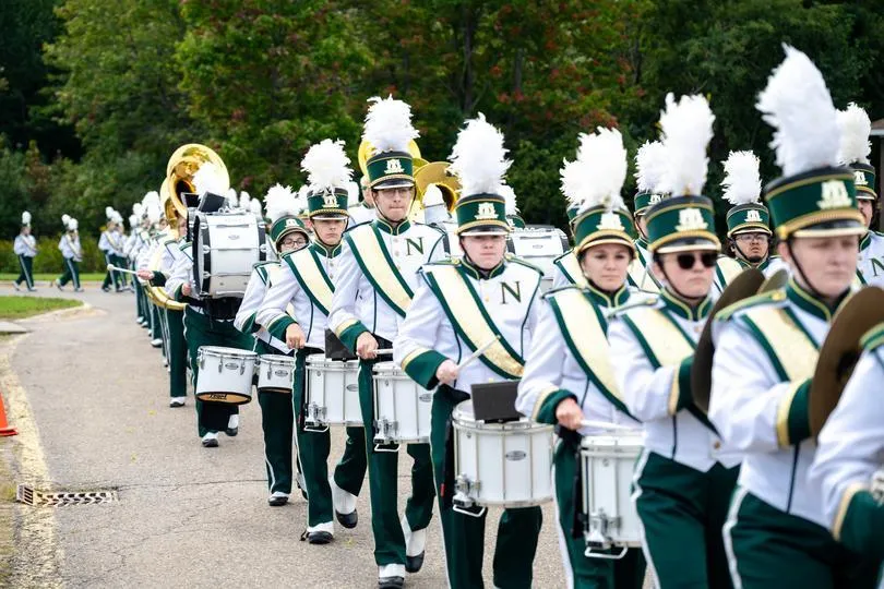 NMU's marching band performs during 2025's Homecoming Tailgate party.
