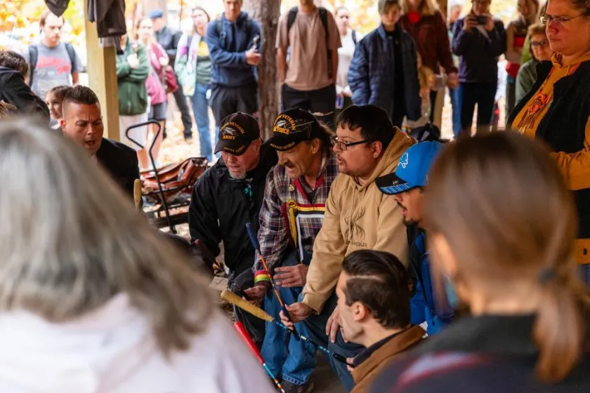 People gather to listen to a drum circle on NMU's campus