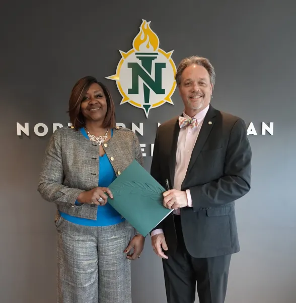 Bay College and NMU Presidents are pictured