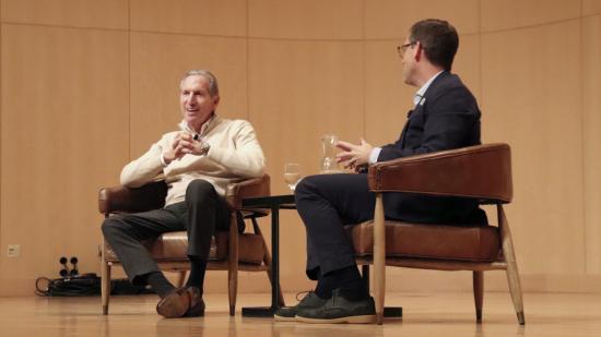 Howard Schultz (left) addresses students during a conversation moderated by President Brock Tessman