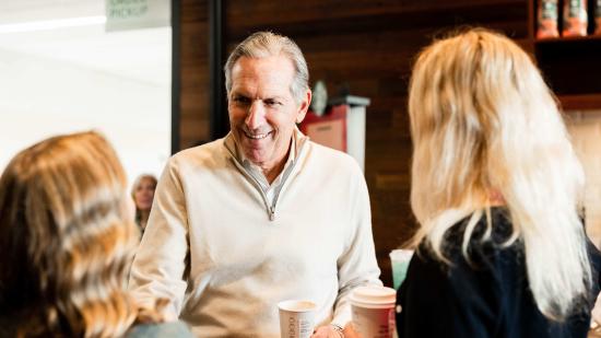 Schultz interacting with students in the campus Starbucks during his October visit