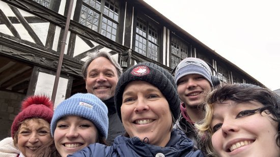 Olsen in back with his son, Ross. In front are (from left) his mother-in-law, Janet; daughter Charlotte; wife Jennifer; and daughter Emma.