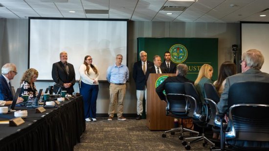NMU Executive Vice President for Finance and Administration pays special recognition to Educational Access Network staff during the Sept. 18 Board of Trustees meeting. EAN staff in attendance were, from left, Don Salo, Lauren Polick, Chris Lewis, Eric Smith and Matt Franti.
