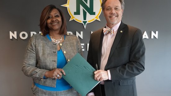 Bay College and NMU Presidents are pictured
