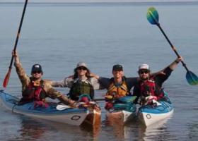 Four kayakers in their kayaks