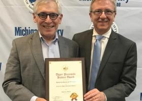 Image of Magnaghi accepting the award