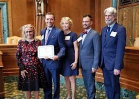 Image of Zac Fosler accepting his honorable mention