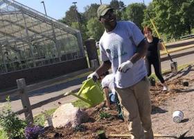 Future NMU student planting a garden