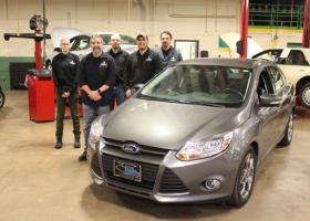 NMU students and faculty with the Ford Focus