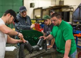 Stock photo of students working in a shop
