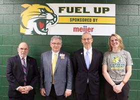 NMU President Fritz Erickson, Marquette Meijer Director John Spaulding, NMU Athletics Director Forrest Karr and Wildcat volleyball player Sarah Kuehn