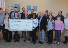 Pictured (from left) are: River Valley Bank representatives Jeff Prophet, Mike Mattila, Ashley Cody, Jake Trucco and Lea Dziesinski; Shane Kentala of UPHS; Paul Mann of NMU; Greg Lahti and Dr. Sonia Geschwindt of UPHS Neurosurgery; NMU reps Megan Altekruse, Rob Winn, Joe Duffy, Amber LaCrosse, and Dan Raymond; Joy Osti of UPHS; Nick Shortreed of NMU; and Emily Wright of UPHS.
