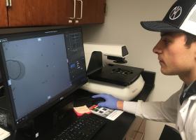 Graduate student Joe Duffy looks at an image generated by the new microscope.