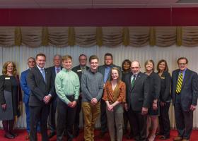 From left: Trustee Tami Seavoy, NMU Board Chair Robert Mahaney, Connor Loftus, Trustee James Haveman, Ryan Watling, Trustee Stephen Young, Michael Stamm, Kevin Store, Hailey Donohue, Trustee Bridget Summers, NMU President Fritz Erickson and Trustees Alexis Hart, Lisa Fittante and Steve Mitchell.