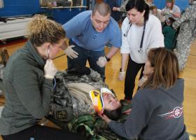 Nursing students respond to patient with a head injury.
