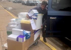 Wheeler prepares to transport the donations.