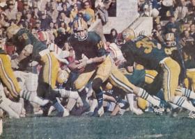 NMU quarterback Steve Mariucci hands off to running back Randy Awrey for the game-winning touchdown run against Western Kentucky in the DII championship