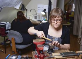 Millner and an assistant in the studio (NMU file photo)