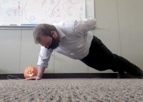 UAW Local 2178 member and challenge participant Ben Chaney does a pushup in his office.