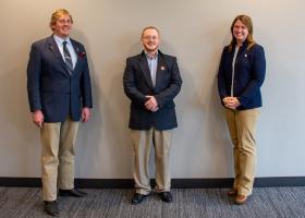 Sherman (center) with McBroom and Cambensy