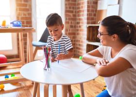 Care provider with child (iStock photo)