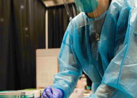 NMU stock photo of campus mass testing event and the PPE nursing students wear regularly.