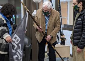 BSU members present a Black Lives Matter flag to Hanson (North Wind photo)
