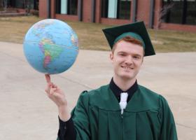 The world is spinning with possibilities for NMU 2021 grads, like Jared Evans of Marquette, to make a difference.