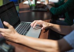 Individual with notebook computer