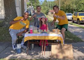Millie with three of the Wildcat football players who bought lemonade.