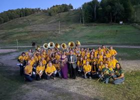 Grugin (front center with his wife, Betsy) and NMU band members at the awards event.