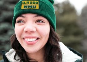 NMU student Brianna Sartin sporting a beanie with the new name
