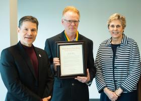 Mann (center) with Interim Provost Dale Kapla and Interim President Kerri Schuiling