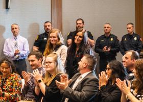 Penhale and her daughter (standing), with some of her rescuers near and behind her.