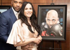 DaVarryl and wife Jennifer with his framed image from the ceremony (J Mariah Images)