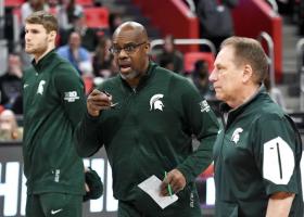 Garland (center) left his spot on Izzo's bench for a period this past season while his son recovered from heart surgery in Cleveland (photo by Nick King/Lansing State Journal).