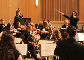 Rhyneer leading the NMU Orchestra