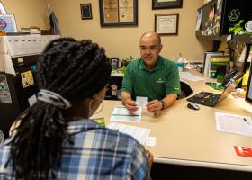 Adviser Jose Garcia with a student