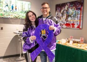 Preston with NMU President Brock Tessman at the Wildcat hockey game vs. LSSU