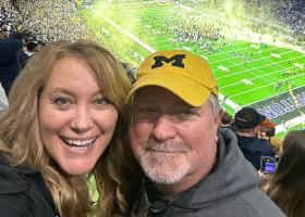 Nanette Hanson cheering on Michigan at the game (Facebook photo)