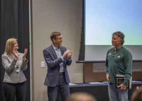 Don Wernholm (right), receives one of the Excellence in Service Awards from Rhea Dever and President Brock Tessman